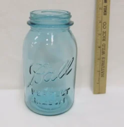 Light blue jar with ruler next to it showing 7 inches tall