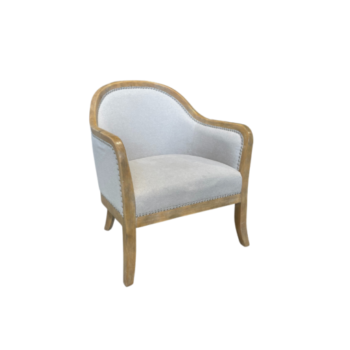 Armchair with light wood frame around the top, down the arms, and into the legs. Soft beige fabric on seat, back, and around the back of the chair. Silver nailhead trim.