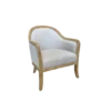 Armchair with light wood frame around the top, down the arms, and into the legs. Soft beige fabric on seat, back, and around the back of the chair. Silver nailhead trim.