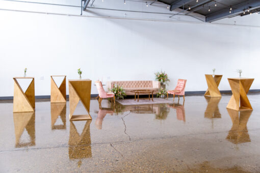 Highboy tables made from wood and in a twist formation.