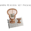 Peacock chair with a rattan side table and a white rug and gold pillow