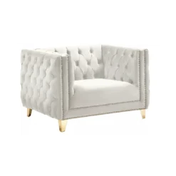 Side view of cream / white velvet square oversized chair with button tufted sides and back, gold nailhead trim and gold legs.