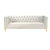 White velvet square sofa with button tufting and gold nailhead trim and legs