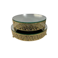 Two ornate gold cake stands with mirror tops stacked. 10 inch diameter on top and 12 inch on bottom.