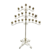 Gold floor standing candelabra with 3 wide symmetrical arms. Bottom arm has 4 spots of candles on both the right and the left side of the post, middle arm has 3 and the top arm has two.