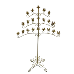 Gold floor standing candelabra with 3 wide symmetrical arms. Bottom arm has 4 spots of candles on both the right and the left side of the post, middle arm has 3 and the top arm has two.