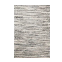 Textured rug with flecks of tan, beige, and shades of blue.