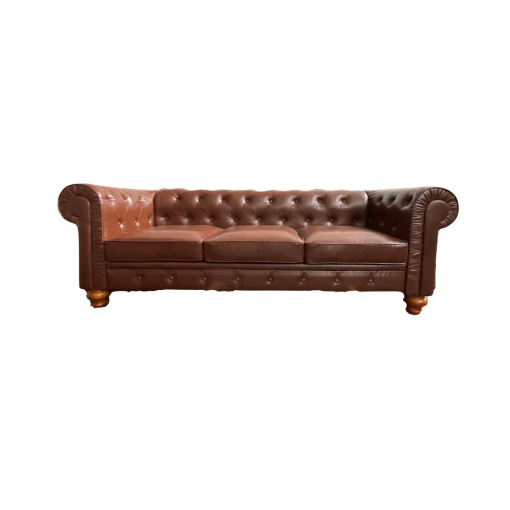 Brown faux leather sofa with 3 cushions, tufted back, round arms and brown wooden legs against a white backdrop.