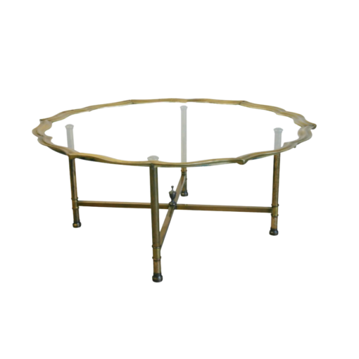 Brass coffee table with Hollywood Regency scallops edge and glass top. 4 brass legs.