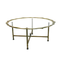 Brass coffee table with Hollywood Regency scallops edge and glass top. 4 brass legs.