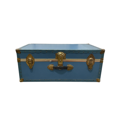 Vintage blue trunk facing front with brass locks on either side and a lock in the middle. Handle under the main lock.