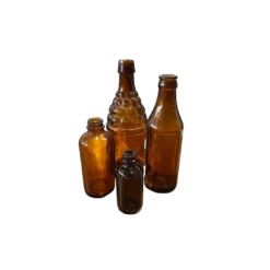 4 Vintage mismatched brown glass bottles of various sizes
