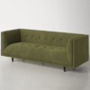 Olive green velvet square sofa at an angle showing the straight flat side