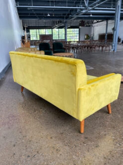 Back of yellow velvet sofa