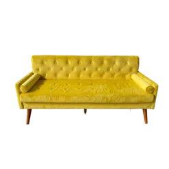 Vivid yellow velvet mid-century sofa with diamond tufting, bolster cushions, and tapered wood legs