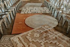 Rug aisle with a variety of patterns, colors, and shapes