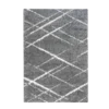 Plush gray shag rug with white lines at angles making messy diamond designs.
