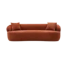 Burnt orange fuzzy boucle fabric in a modern minimalist curved sofa with one piece on the bottom in a half moon shape. No cushions. Two square pillows