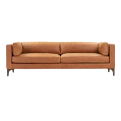 Cognac tan, light brown long sofa with two cushions. Wood legs. Two bolsters on each end.