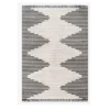 Large gray and beige rug with alternating stripes that create beige diamonds down the middle with gray triangles on the sides.