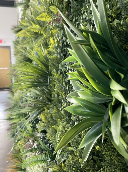 Detail on the greenery wall with texture, colors, and depth