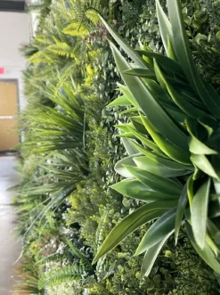 Detail on the greenery wall with texture, colors, and depth