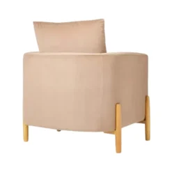 Back view of the Dune Chair showcasing its soft beige fabric and wooden legs