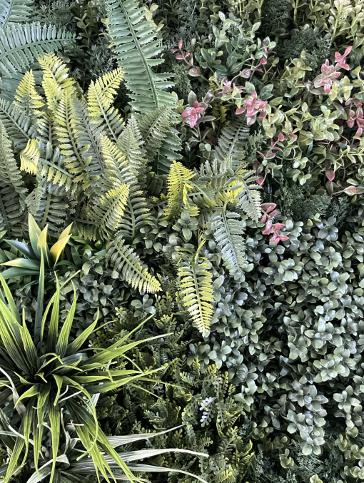 Detail on the greenery wall with texture, colors, and depth