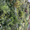 Detail on the greenery wall with texture, colors, and depth