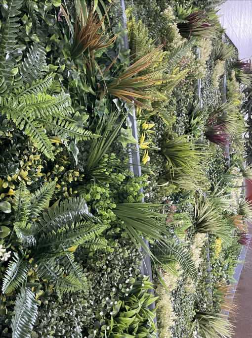 Detail on the greenery wall with texture, colors, and depth