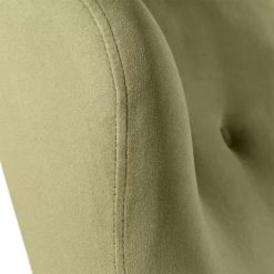 Close-up of the Moss Chair highlighting the soft green fabric and stitching details.