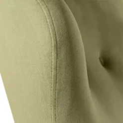 Close-up of the Moss Chair highlighting the soft green fabric and stitching details.