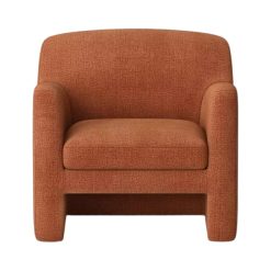 Front view of the Terrabello Chair featuring its plush cushion, armrests, and rust-colored fabric.