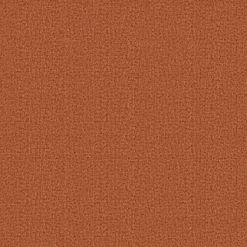 Close-up view of the Terrabello Chair's rust-colored fabric texture, highlighting the intricate weave and warm hue