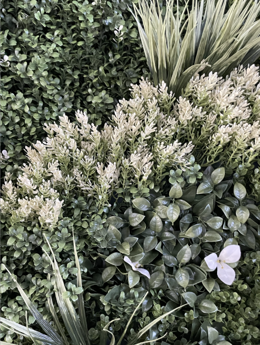 Detail on the greenery wall with texture, colors, and depth