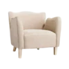 Velvet wing arm chair in beige. Scallop top, high arms, light wooden legs.