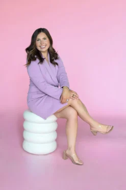Women sitting and posing on Palmer Side Table.