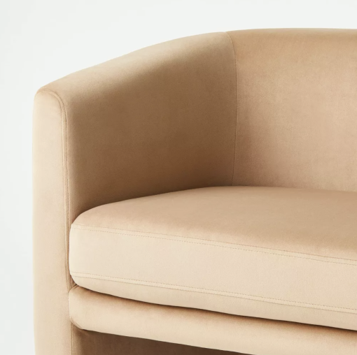 Close up modern velvet tan loveseat