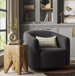 Costello Swivel Chair in styled soft seating lounge area with vintage furniture and decor