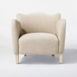 Brinley Chair velvet wing arm accent chair front view in beige with scallop top and wooden legs