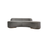 Modern curved gray velvet sofa with one solid base for the seat and raised half back across 3/5ths. Gold legs.