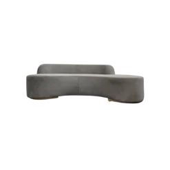 Modern curved gray velvet sofa with one solid base for the seat and raised half back across 3/5ths. Gold legs.