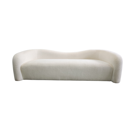 Modern beige shearling sofa with wave back. One piece cushion / seat. No visible legs.