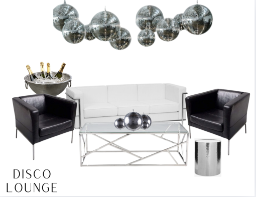 Black and white themed lounge area with leather furniture. White sofa with silver accents, two black boxy chairs. Silver and glass rectangle coffee table in front of the couch with a silver side table. Silver floor length champagne bucket behind a chair and disco balls hanging from the ceiling.