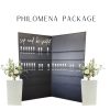 8 foot tall, black champagne wall with two panels. "Sip and Be Seated" in white script on the top left. Holds up 130 champagne flutes. Two white pedestals on either side of champagne panels.