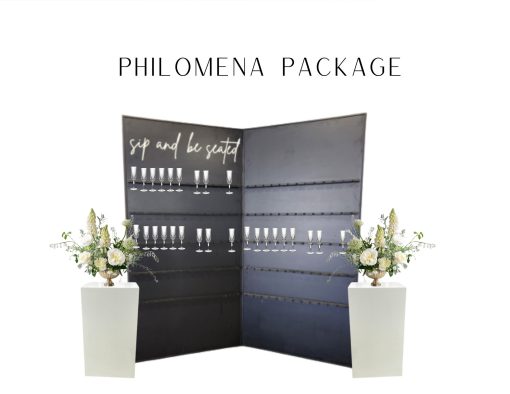 8 foot tall, black champagne wall with two panels. "Sip and Be Seated" in white script on the top left. Holds up 130 champagne flutes. Two white pedestals on either side of champagne panels.