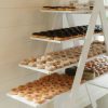 Variety of donuts displayed on a 4 tier A-Frame Shelf