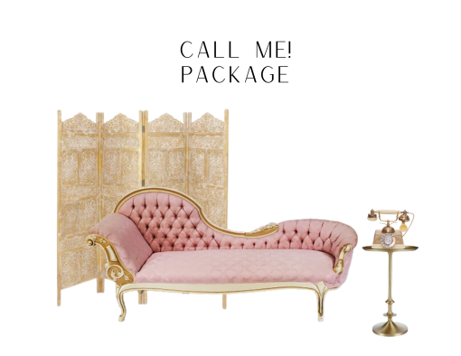 A pink fainting sofa with a gold paneled backdrop. Sitting beside the sofa is a small round gold side table and a vintage telephone sitting on top.