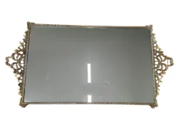 Rectangle mirrored tray with gold trim.