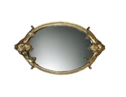 Top view of mirror tray with intricate gold trim.